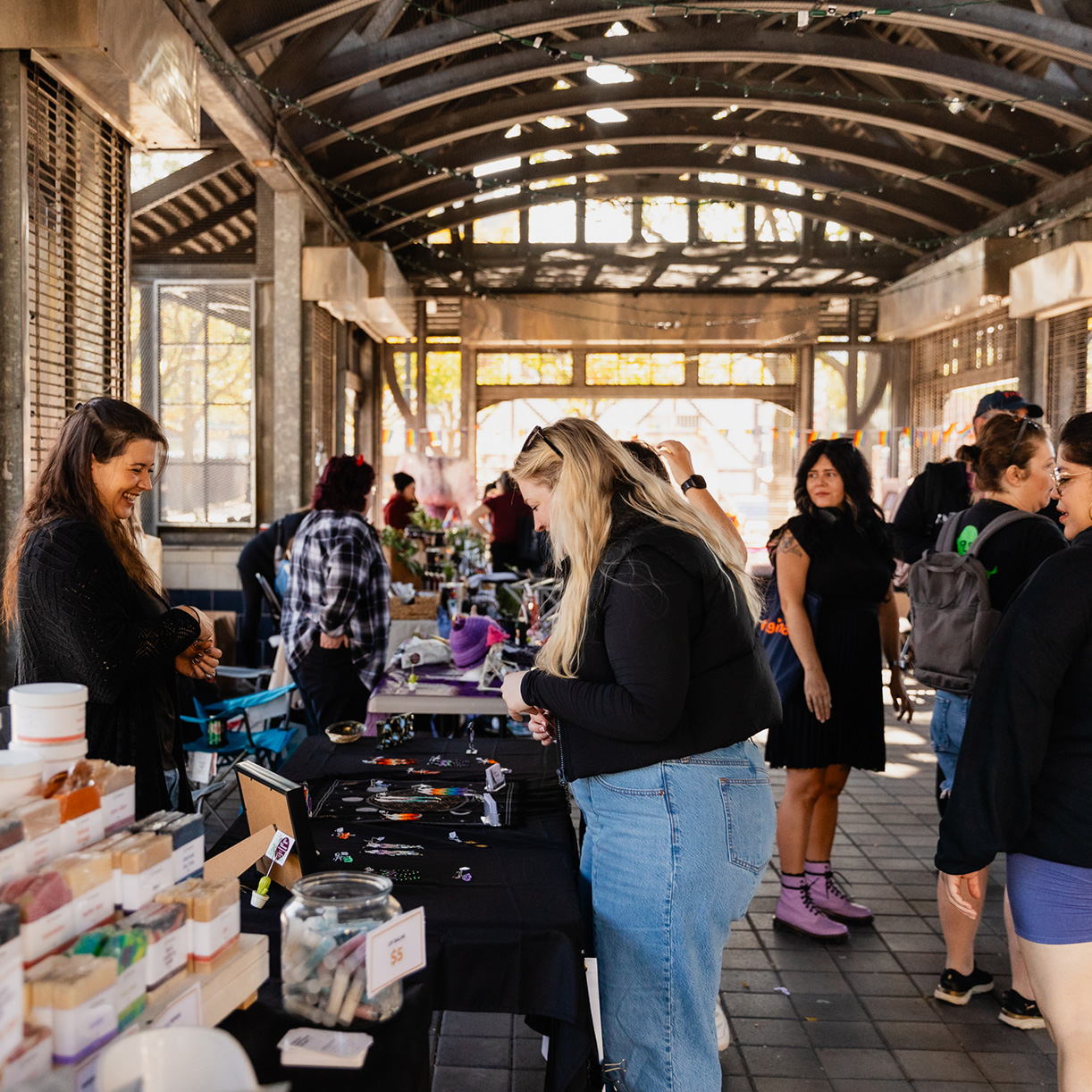 Market event located in the International Village BIA, with people shopping at the vendors' tables